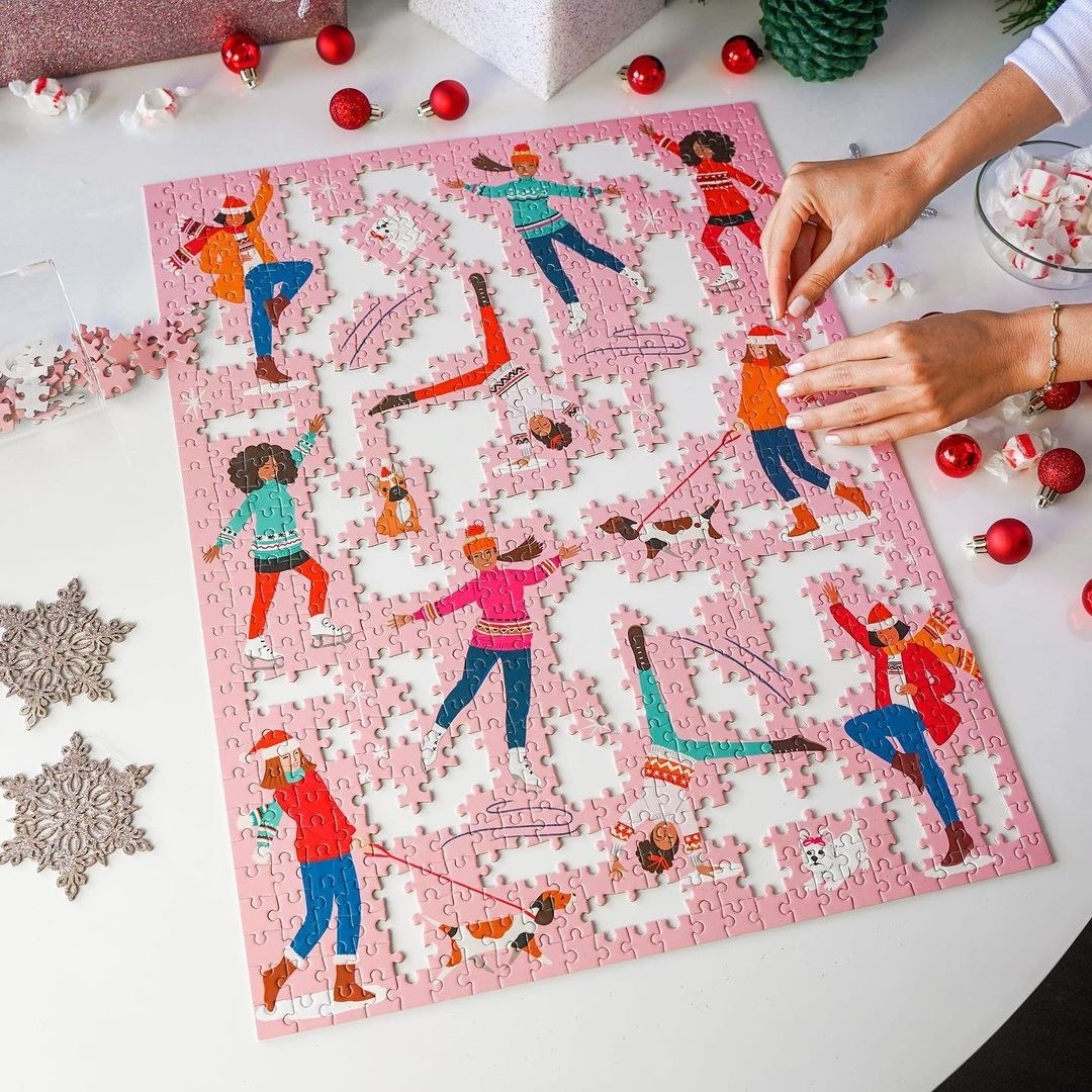 a person putting together the 800 piece puzzle