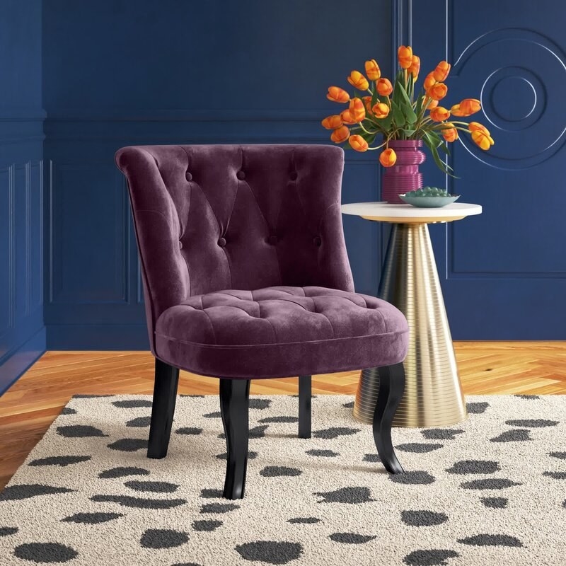 the deep purple chair in a decorated room