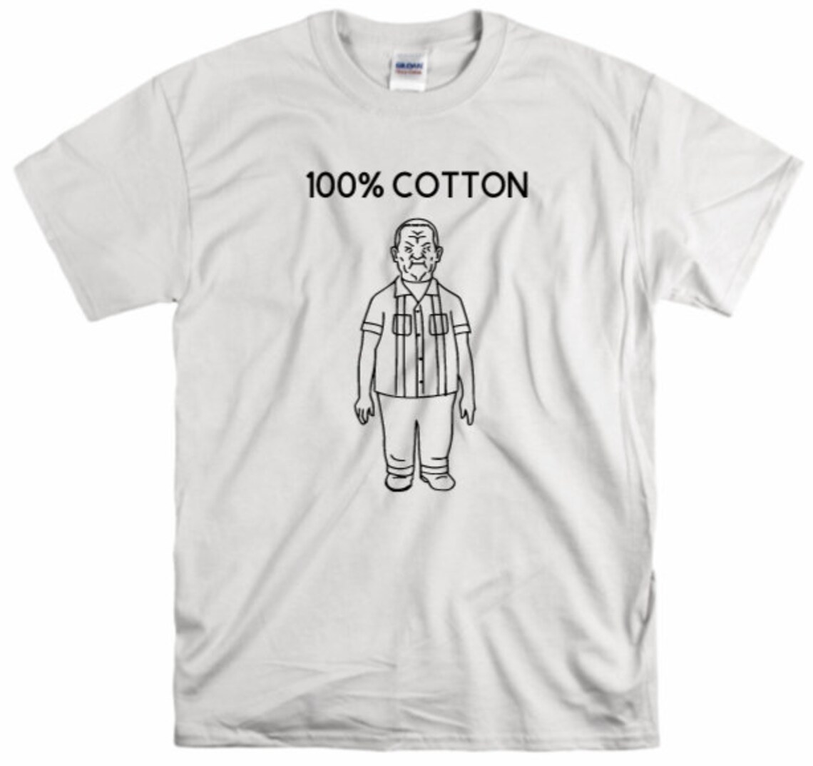 white tee with cotton hill from king of the hill that says 100% cotton