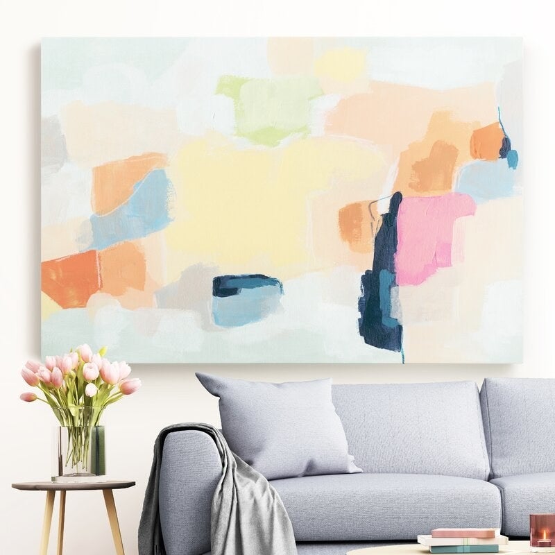 Canvas hanging above sofa and end table