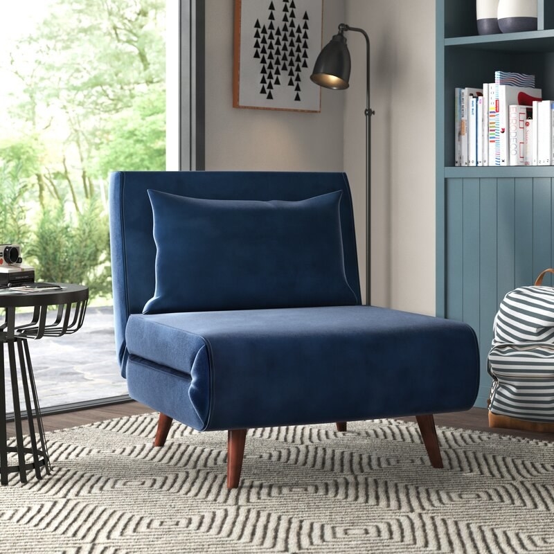 the blue chair in a decorated living room