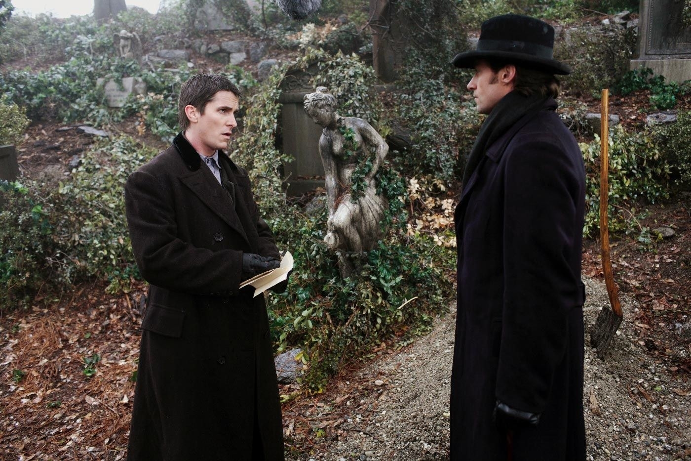 both borden and angier face each other in a graveyard