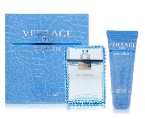Blue Versace cologne next to bottle of lotion and box