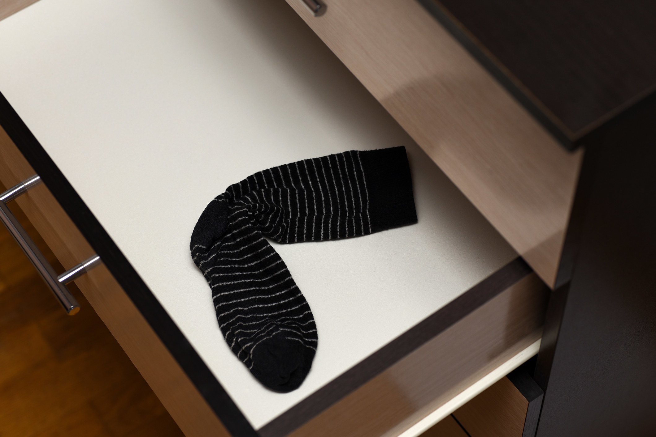 A single sock in a sock drawer
