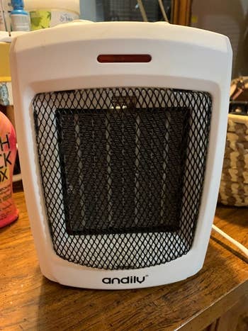 A close-up of the white space heater on a reviewer's table
