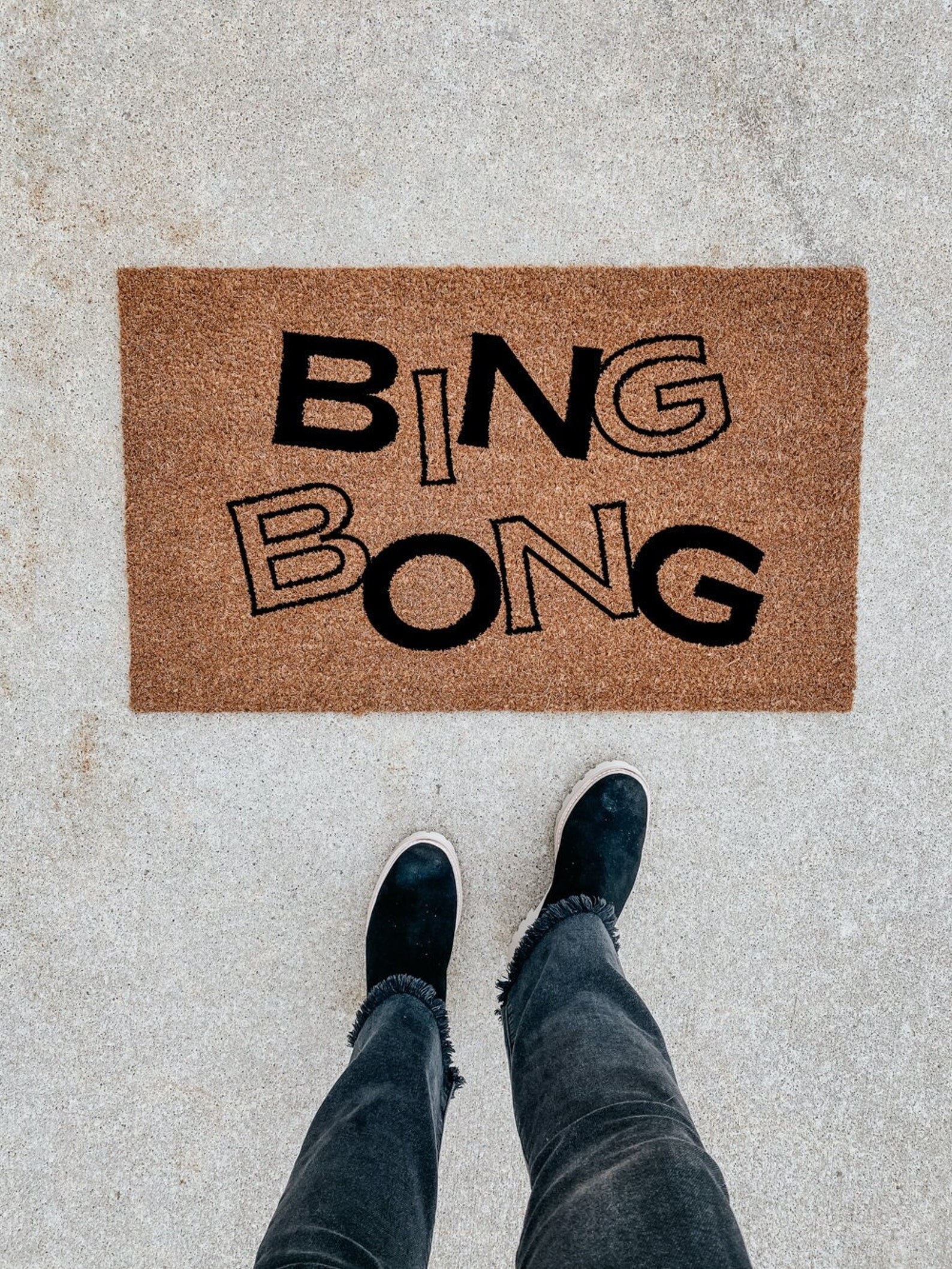 a door mat that says &quot;bing bong&quot;