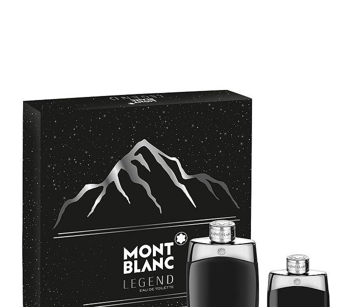 Montblanc black and silver box next to two cologne bottles