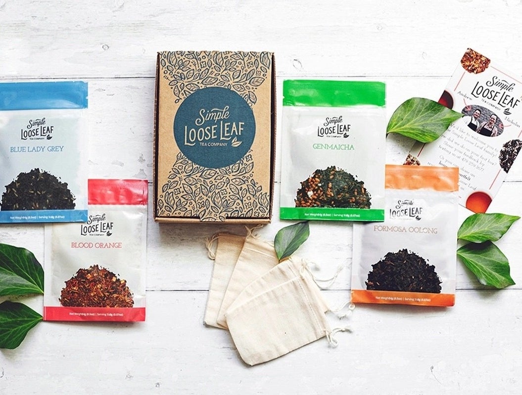 The Simple Loose Leaf subscription box surrounded by four varieties of tea