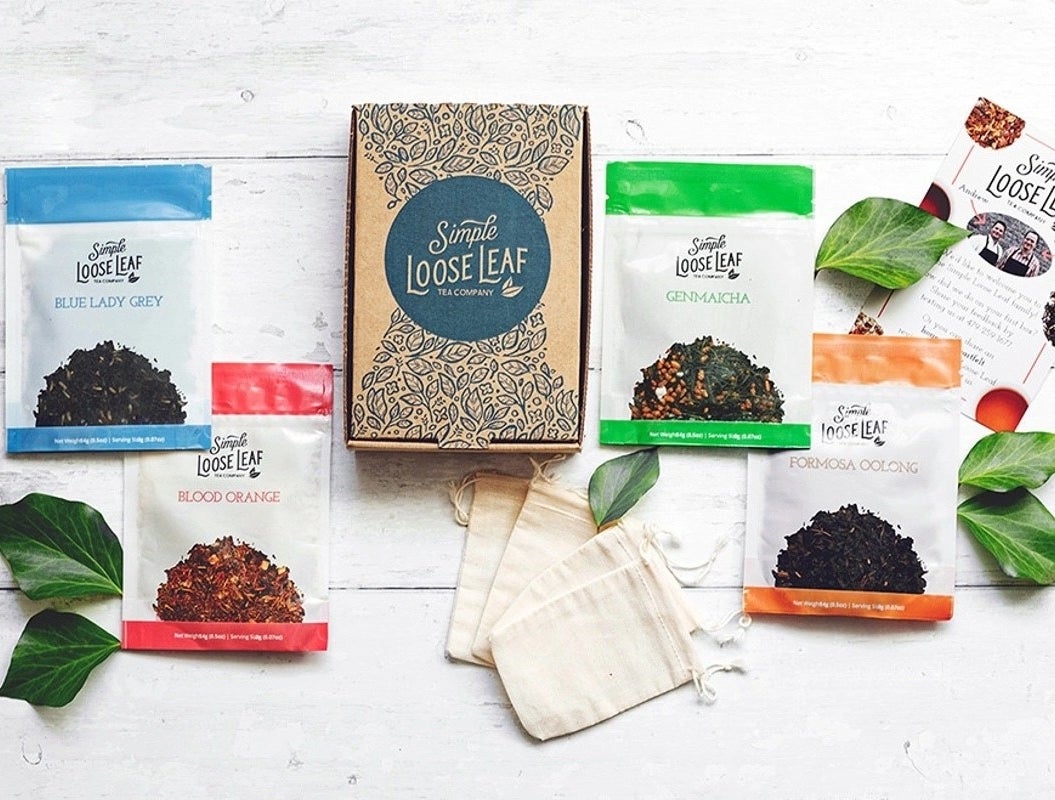 The Simple Loose Leaf subscription box surrounded by four varieties of tea