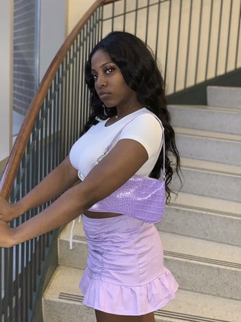 reviewer wears pastel purple mini shoulder bag