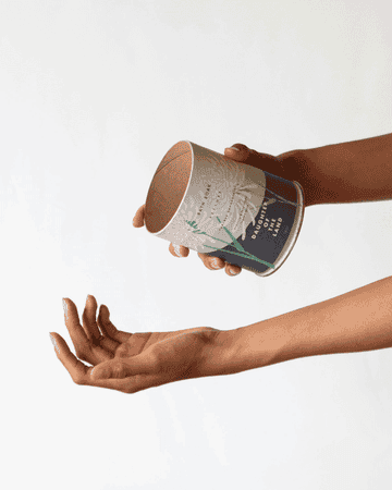 GIF of model pouring bath salts into hand