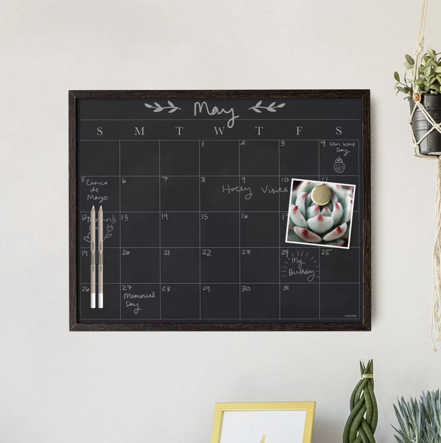 The wood framed chalkboard with someone&#x27;s &quot;May&quot; calendar
