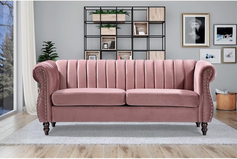 the pink sofa in a decorated living room