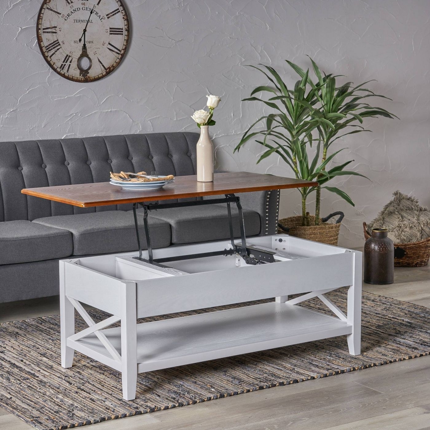 The coffee table in white with the top lifted up