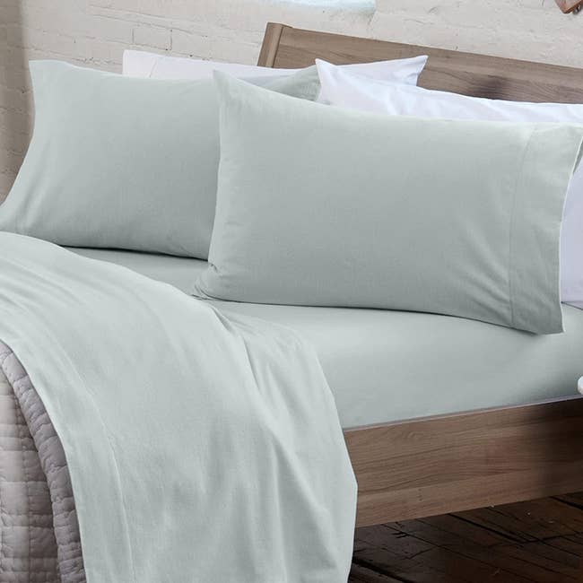 flannel sheets in light blue on a bed