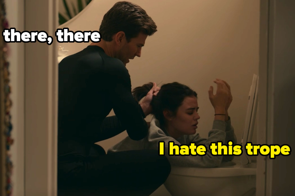 Lucy leaning on the toilet as Josh holds her hair back