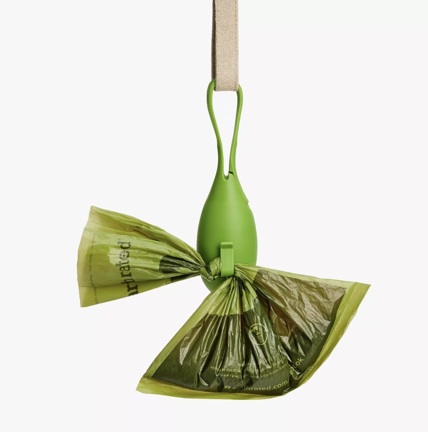 The green dispenser hanging off a leash with a filled poop bag attached to the hook on the dispenser
