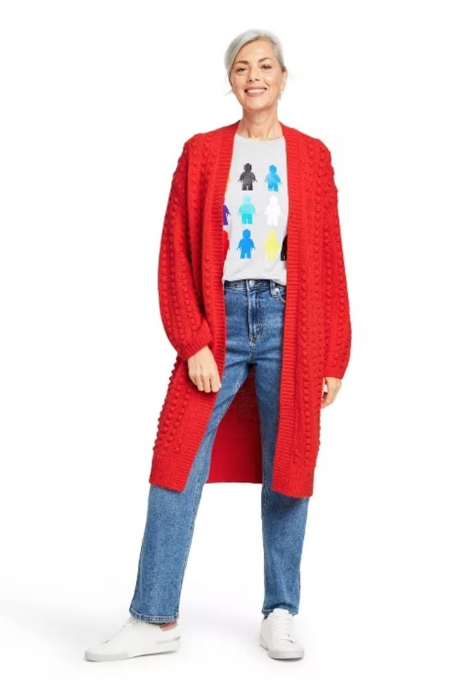 a model wearing the red cardigan