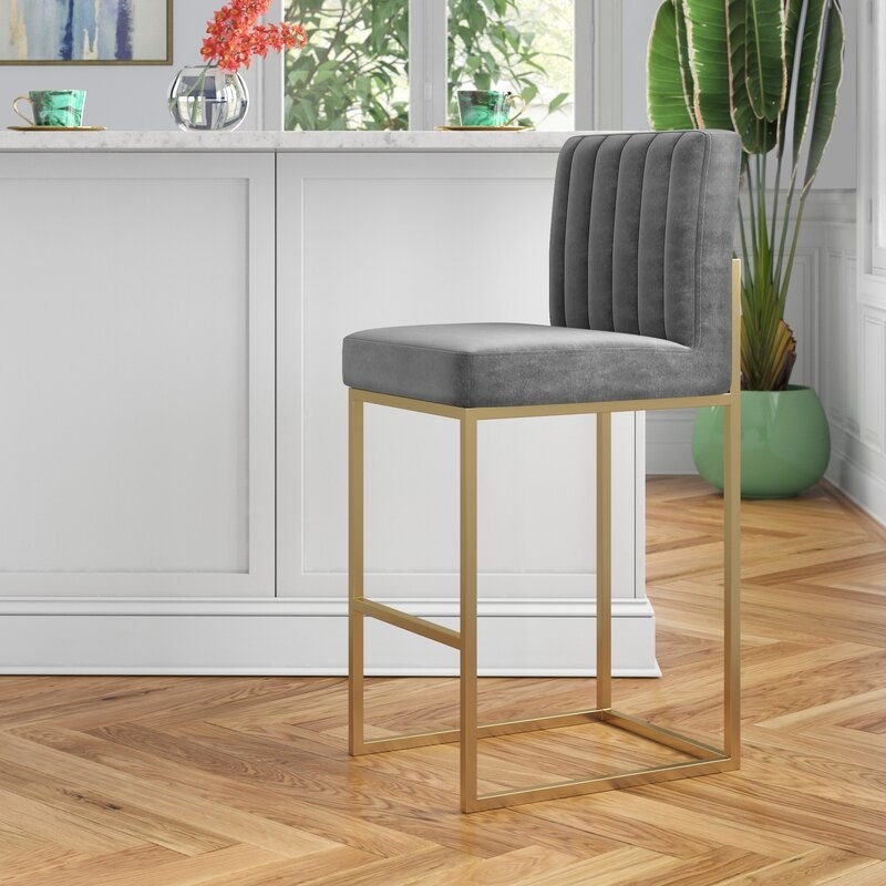 the grey and gold chair at a counter