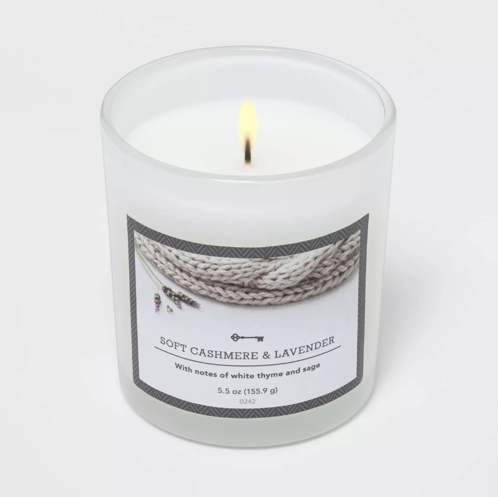 White soft cashmere and lavender single wick candle burning