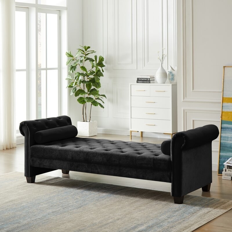 the black chaise in a decorated room