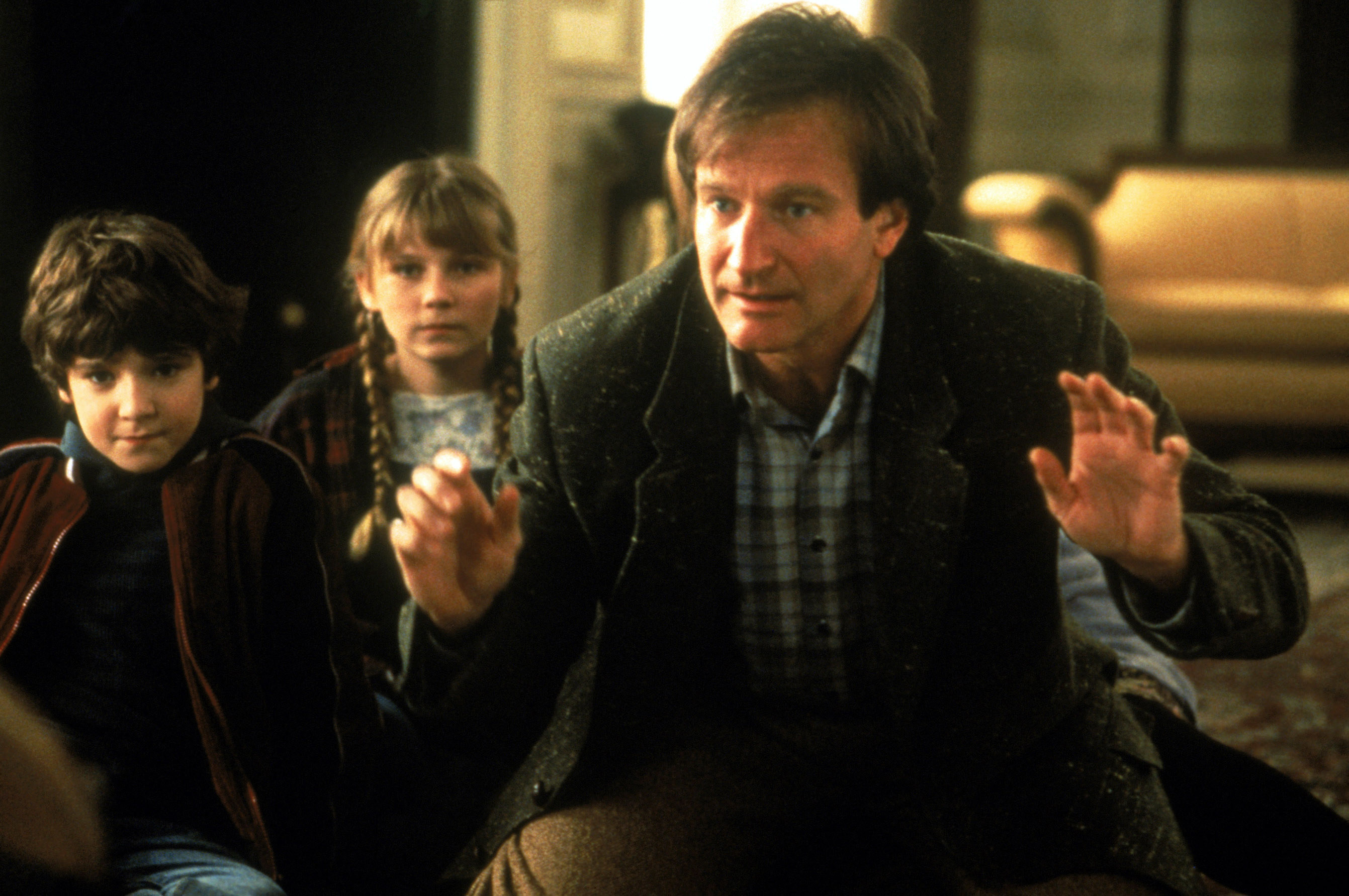 Robin Williams protecting the kids during a scene in the movie