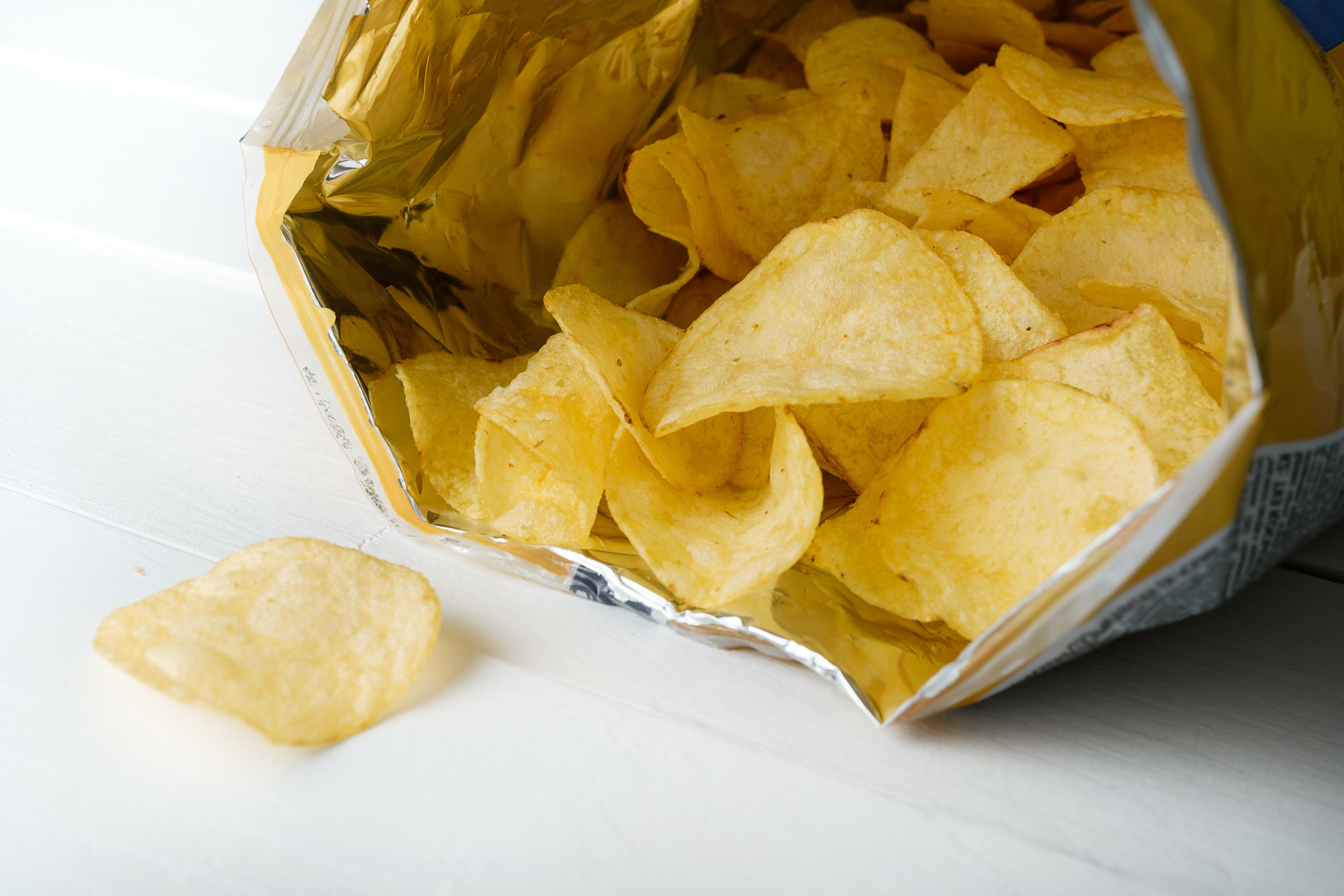 An opened bag of potato chips