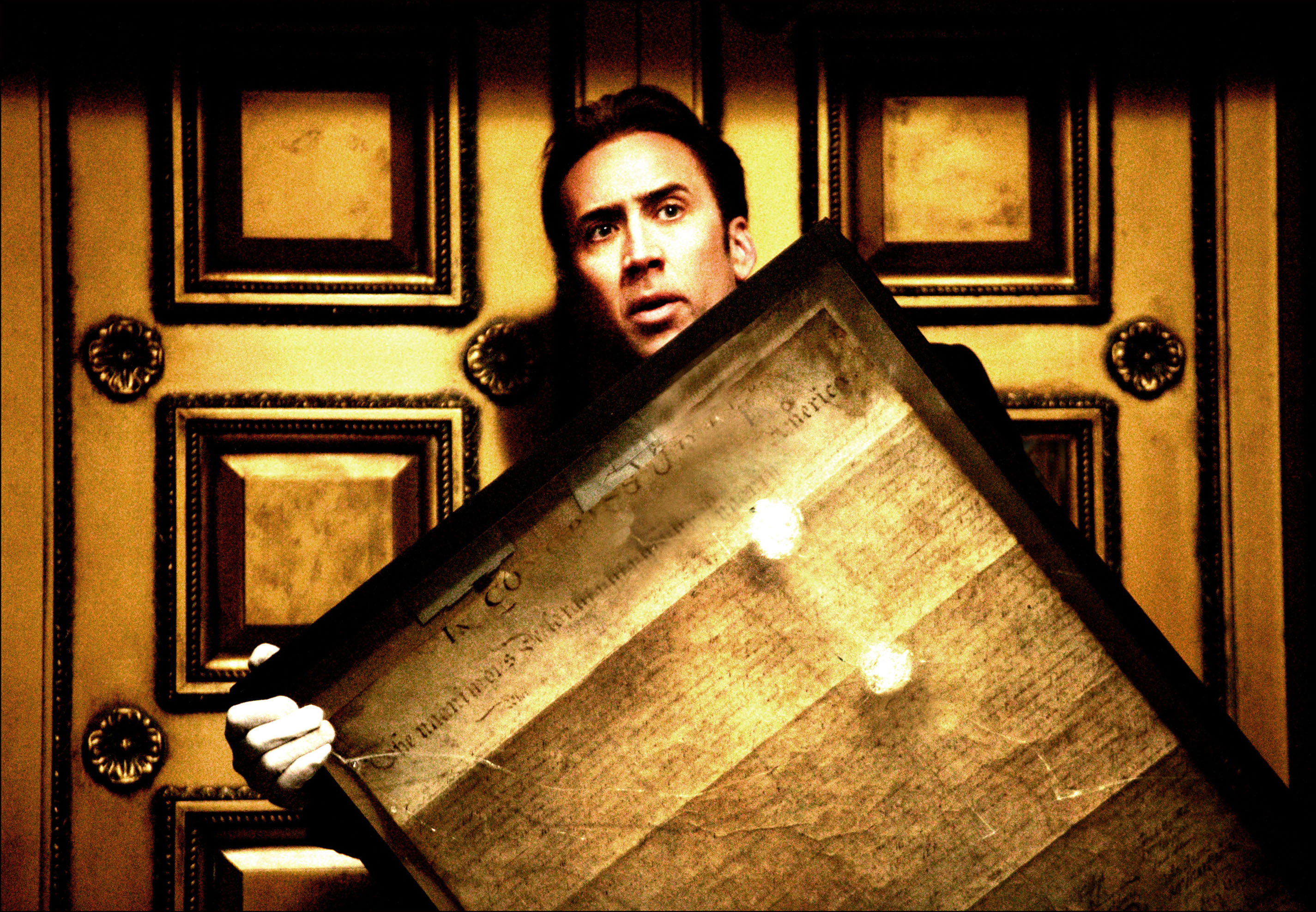 Nicolas Cage holding the declaration of independence during the heist scene