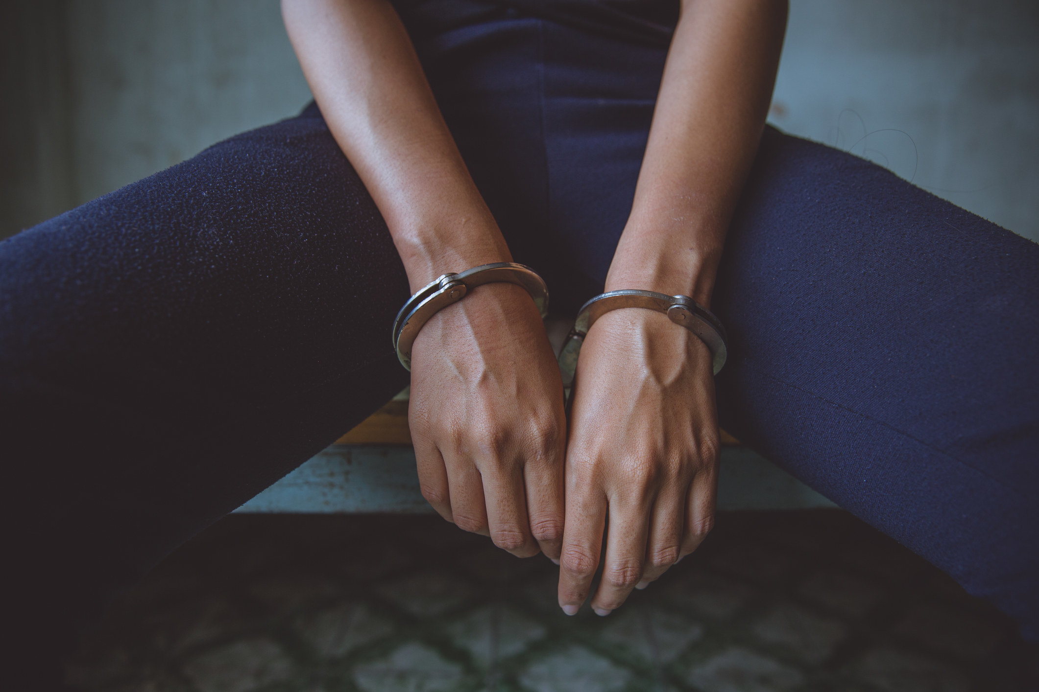 A female inmate with handcuffs