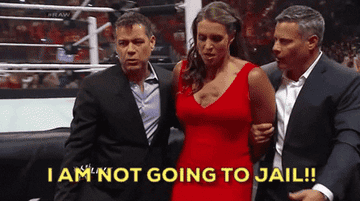 women being led away from WWE match saying &quot;I am not going to jail&quot;