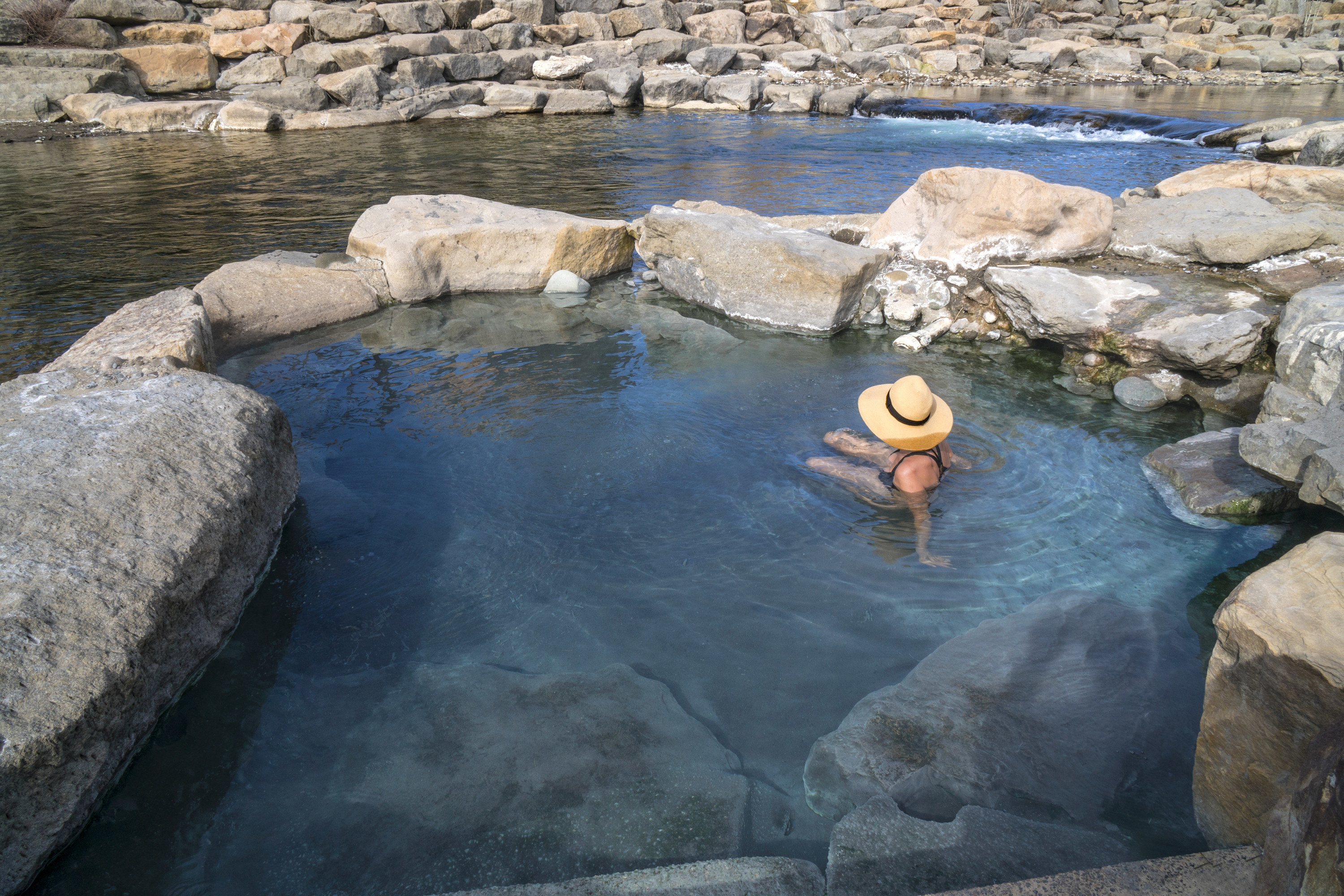 Woman in a pool on the river