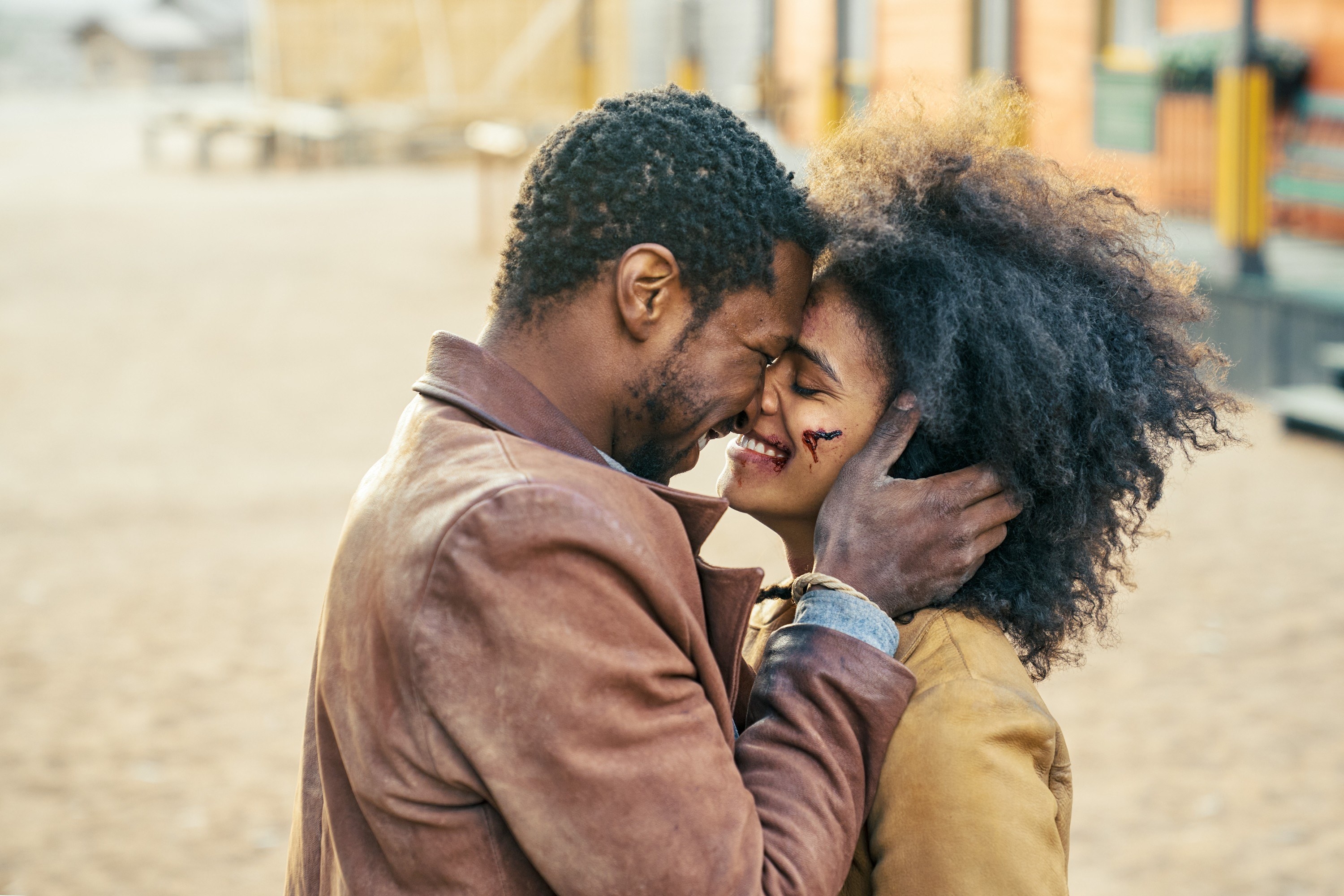Jonathan Majors and Zazie Beetz smile and put their noses together