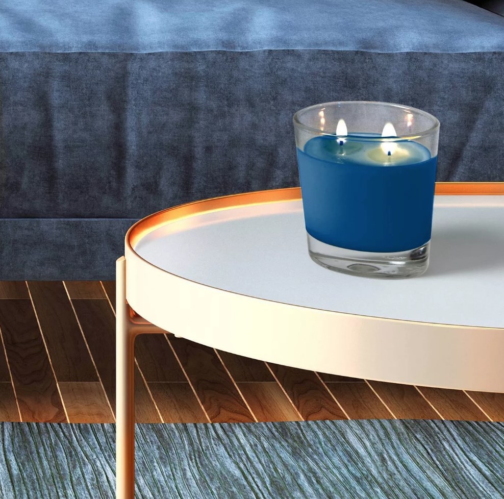 the blue candle on a side table