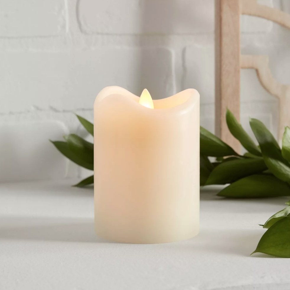 Electric white candle with flame turned on