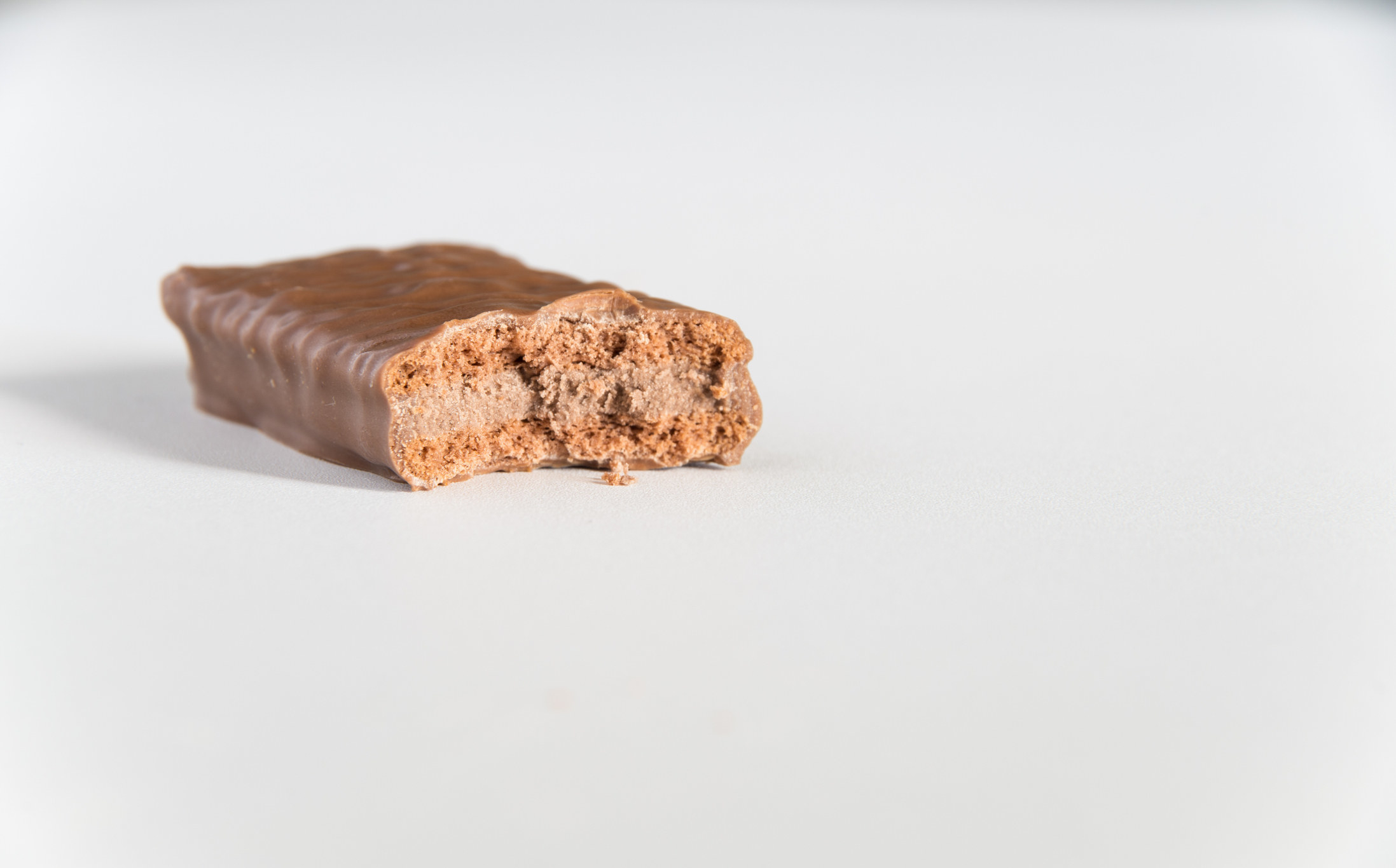 A Tim Tam with a bite taken out of it.