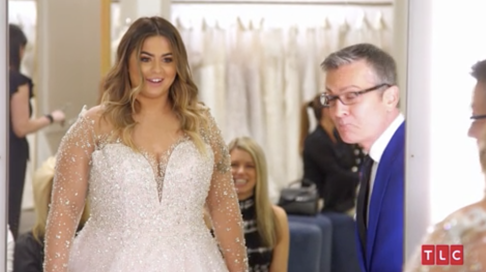 A woman trying on a wedding dress in say yes to the dress