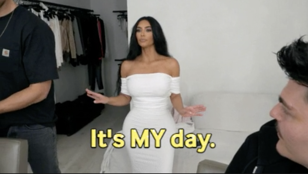Kim Kardashian in a white dress saying &quot;it&#x27;s my day&quot;
