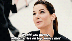 A woman saying, &quot;Would you please, with cherries on top, marry me?&quot;