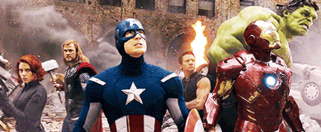 The avengers assembled outside a burning building