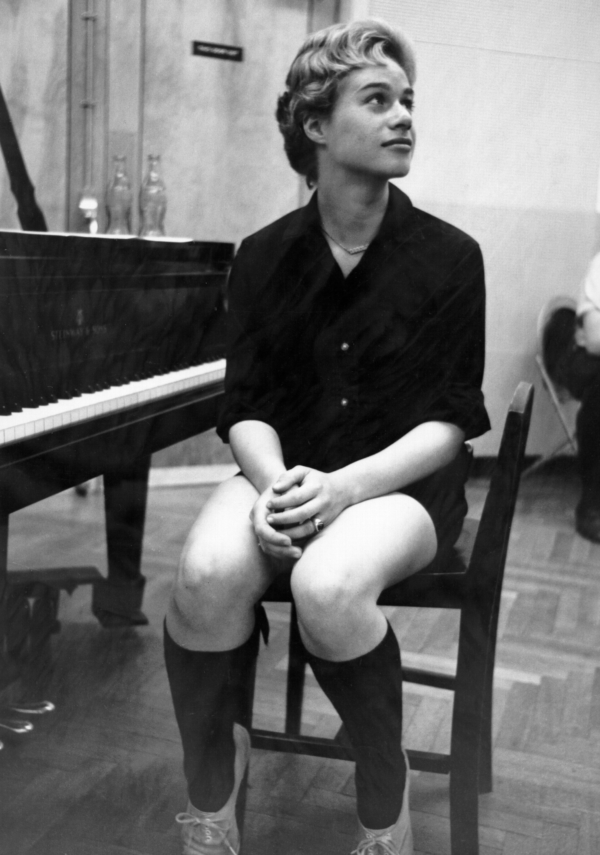 King sitting at a piano in the studio in 1959