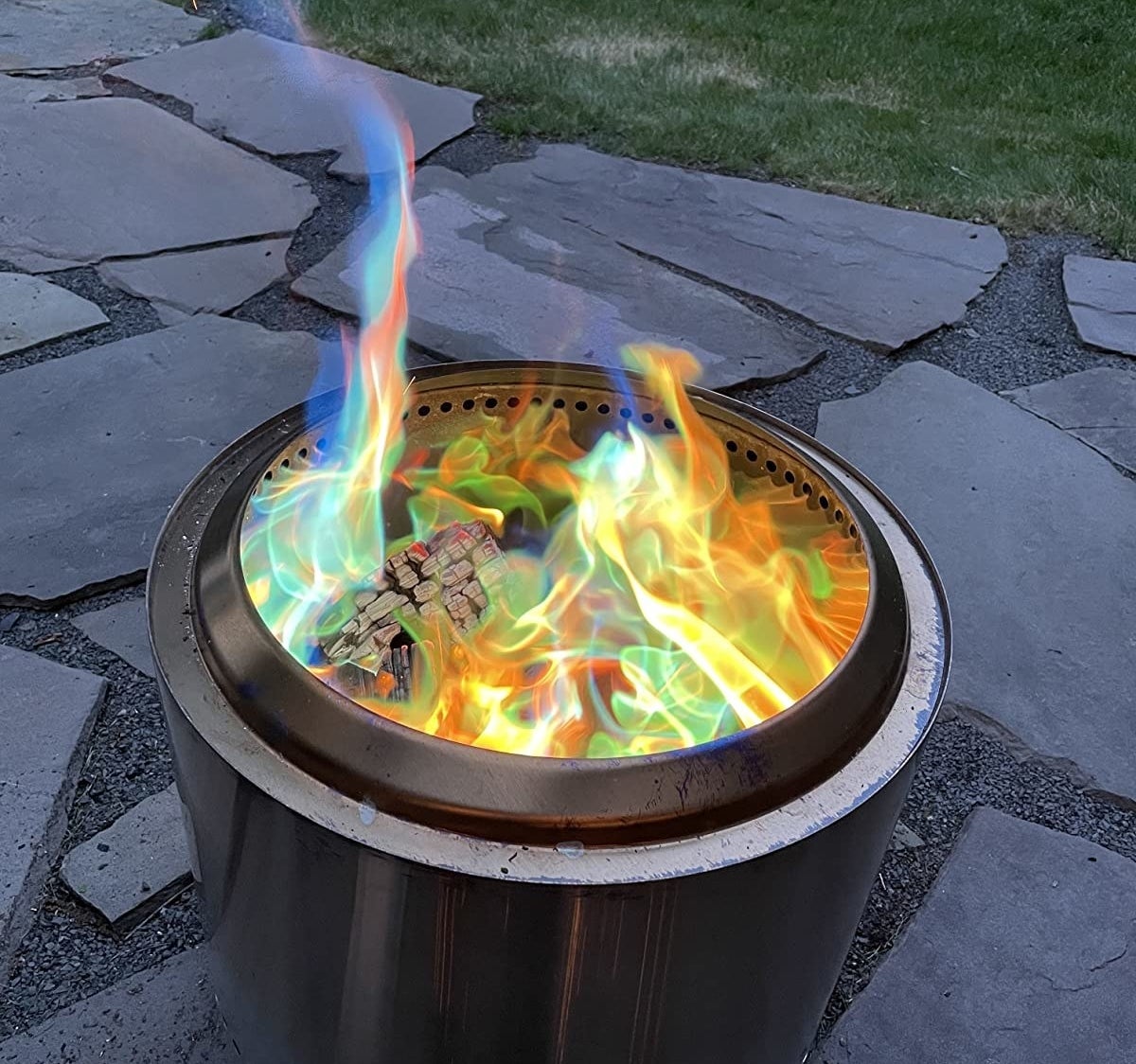 reviewer&#x27;s fire pit with blue, orange, and green flames