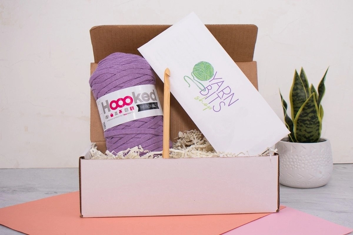 the subscription box with a big spool of yarn and a crochet hook