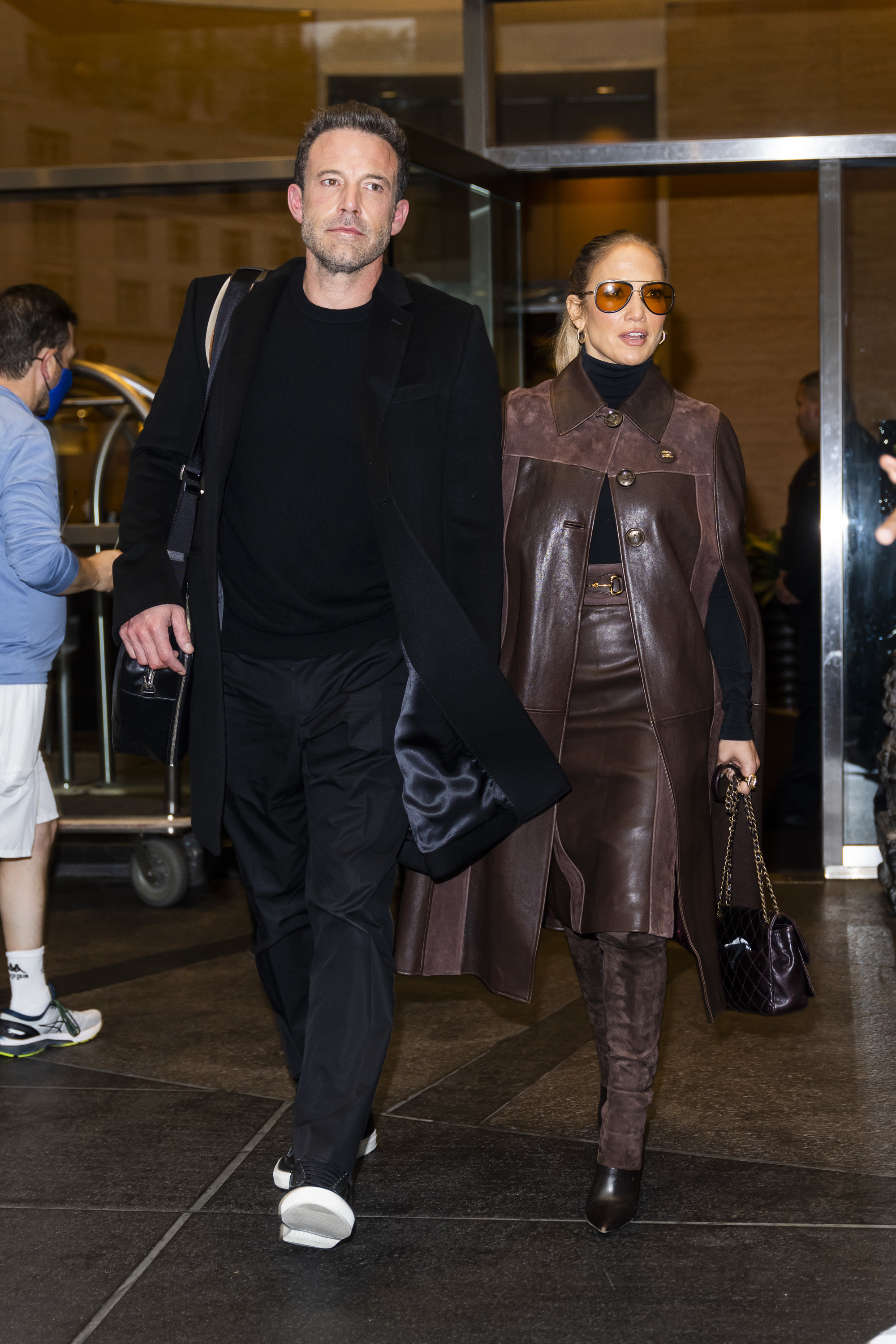 The couple exiting a hotel