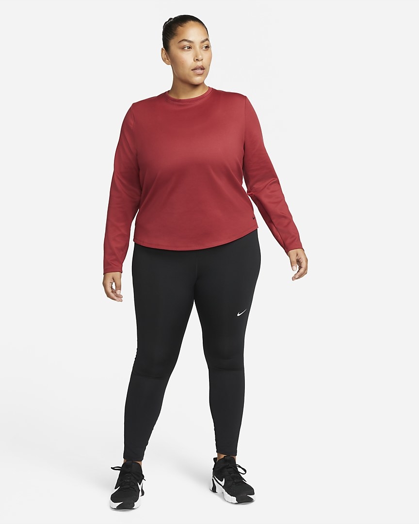 Model wearing the red long-sleeve top with leggings