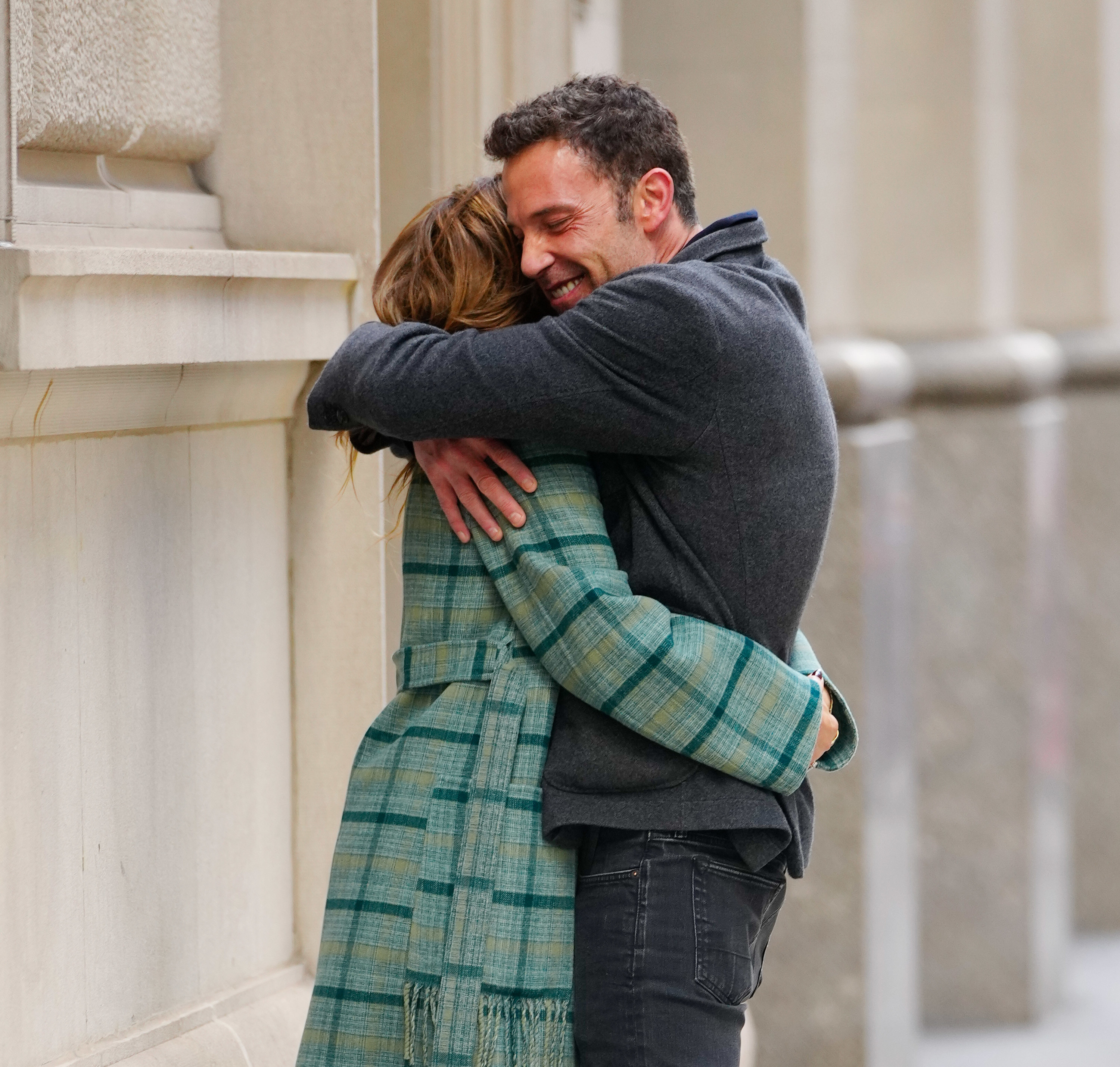 The couple hugging and smiling