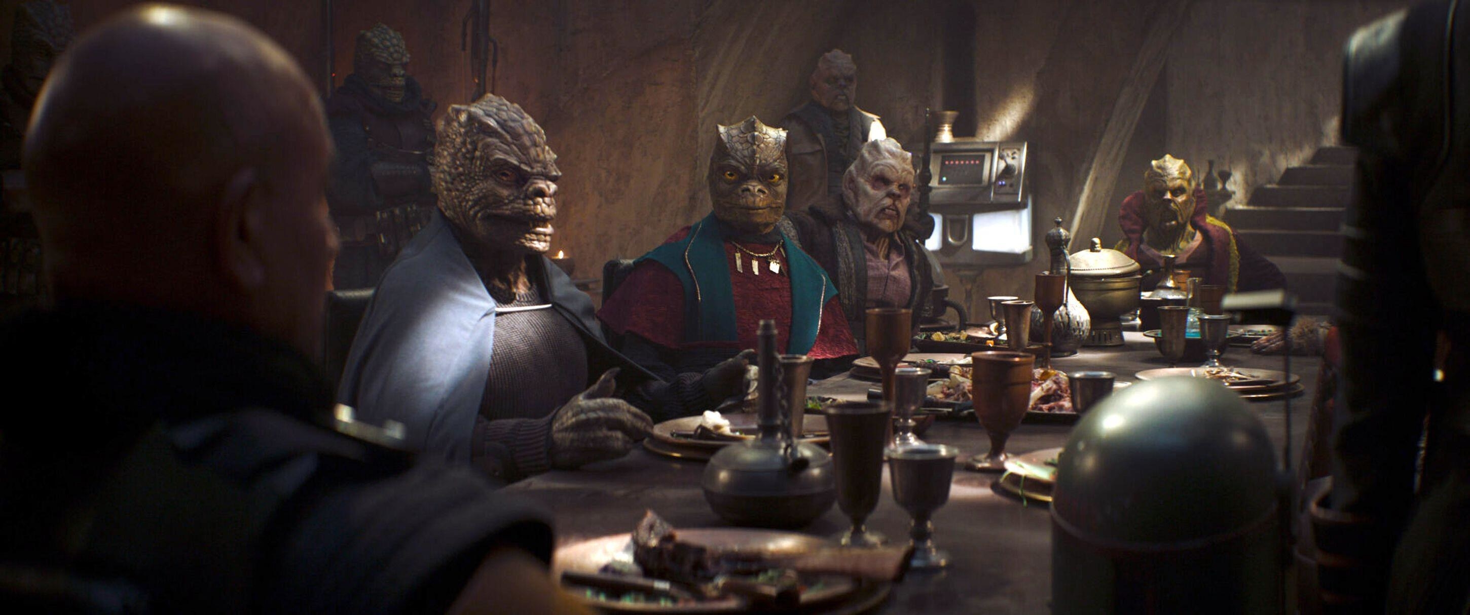 Aliens at a dinner table with Boba Fett