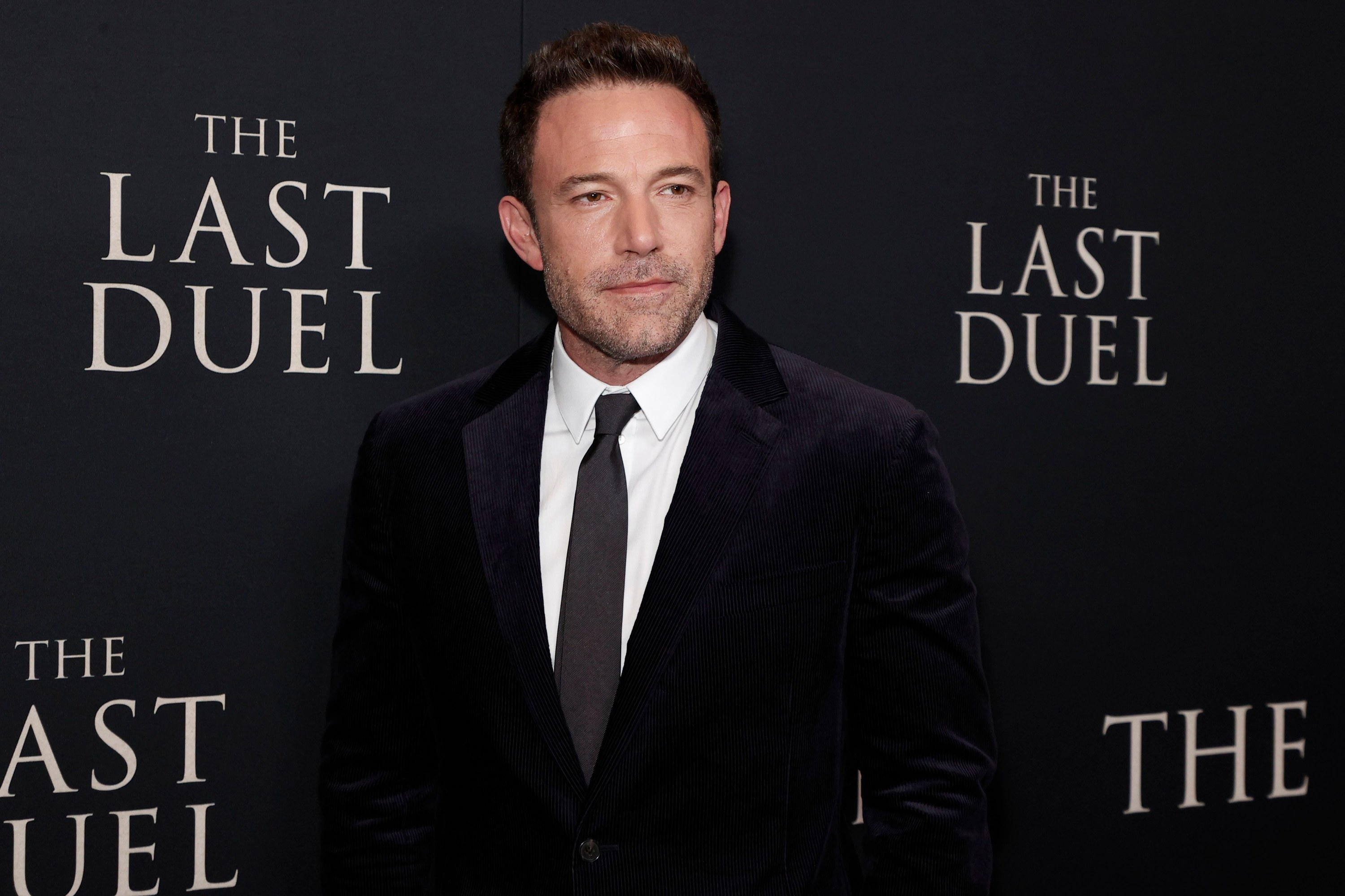 Photo of Ben Affleck in a black suit at the Last Duel premiere