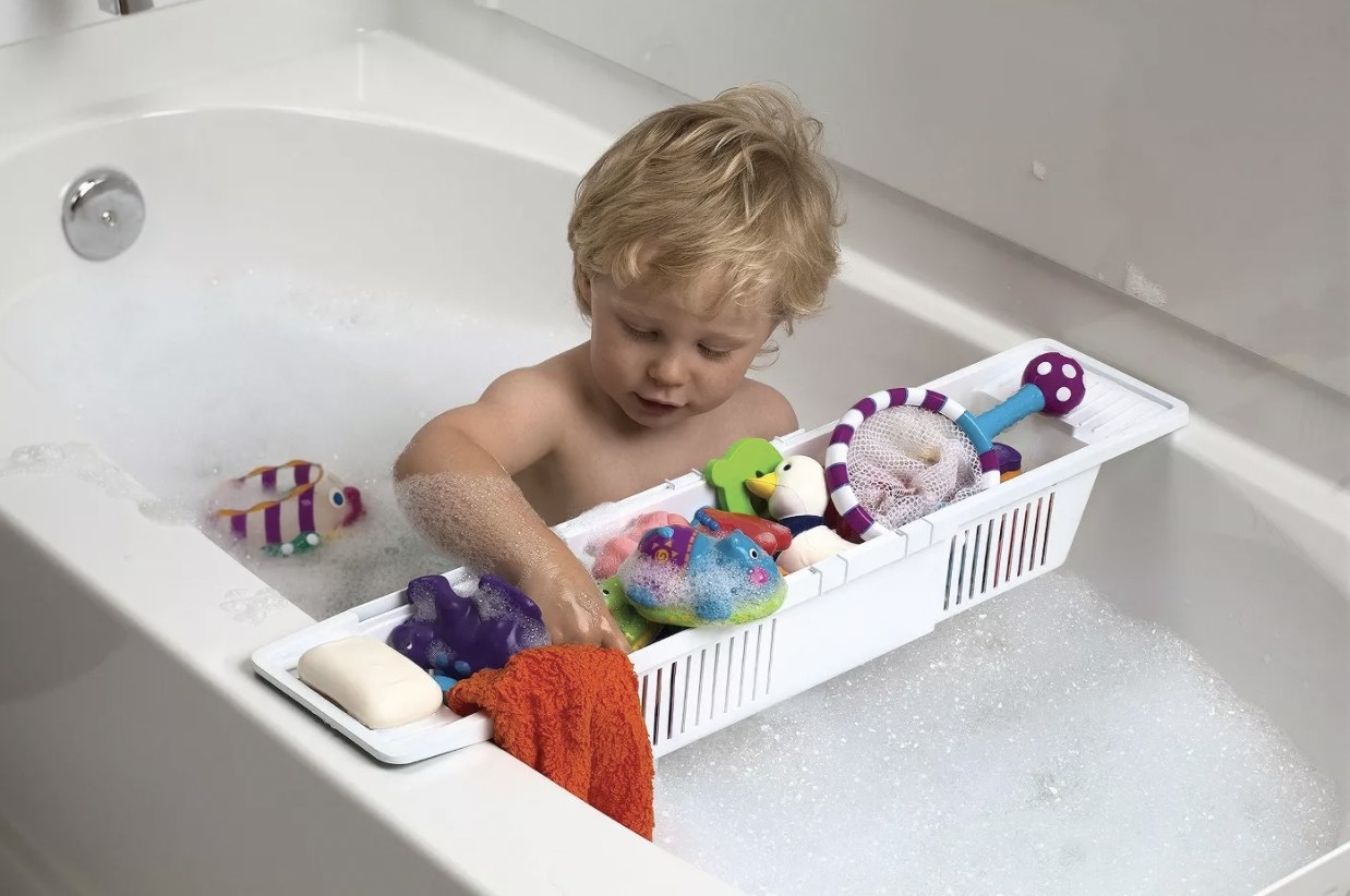 Kid using bath storage basket