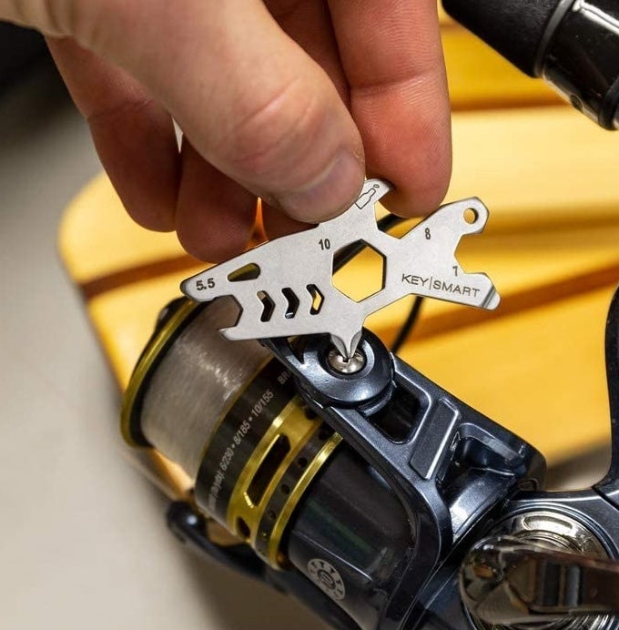 A person fixing something with the shark screwdriver