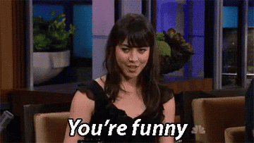 Woman pointing at the camera and saying &quot;You&#x27;re funny&quot;
